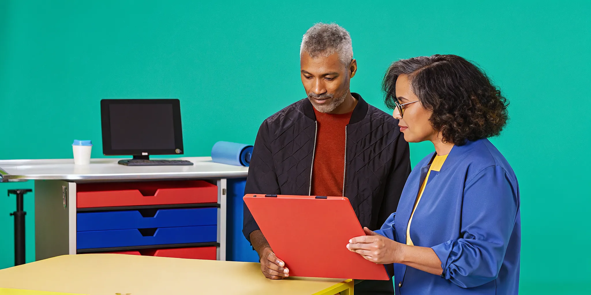 Practice administrator coaching a staff member during software competency review
