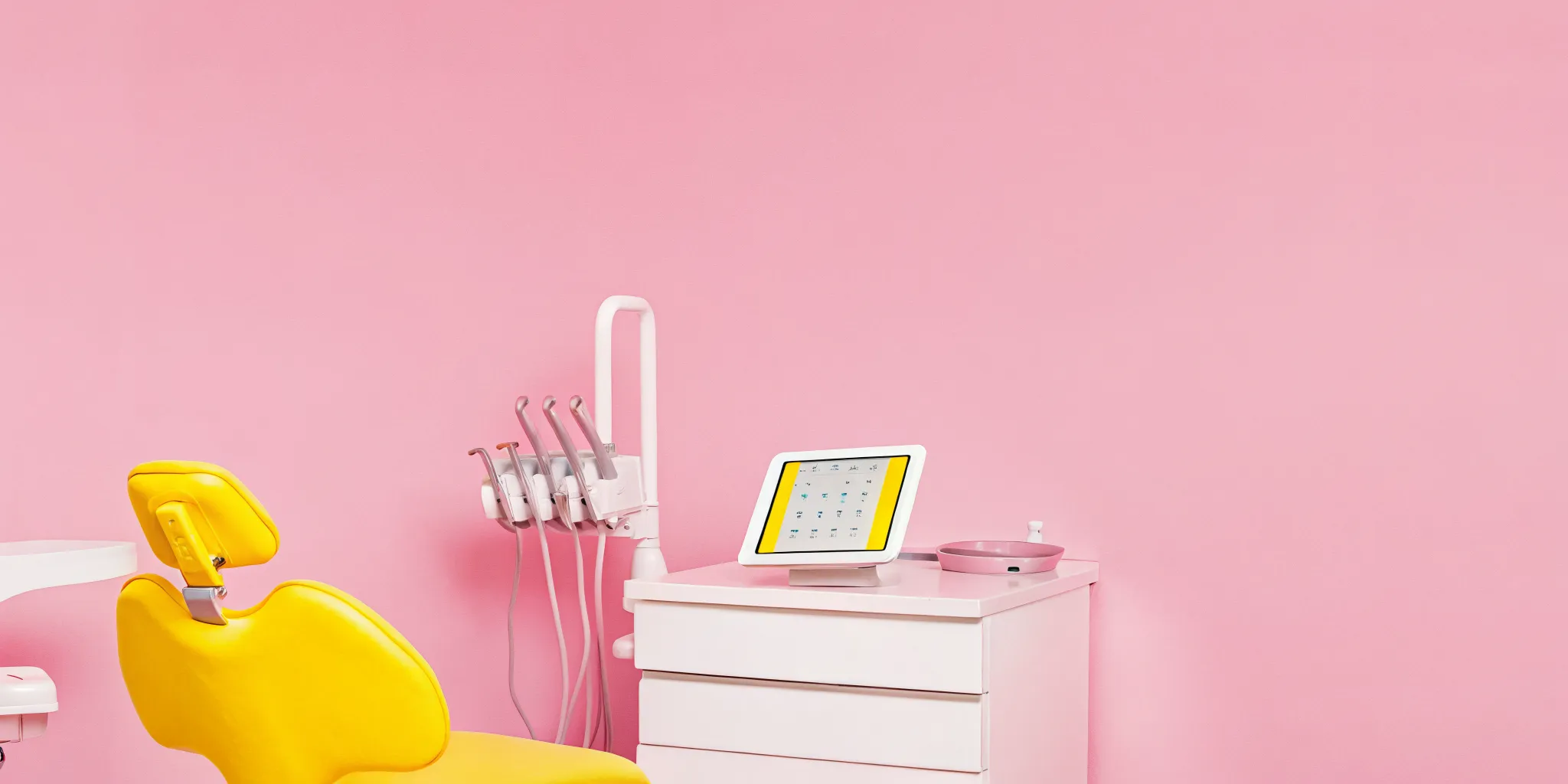 Modern oral surgery clinic with digital tablets and practice management software on display