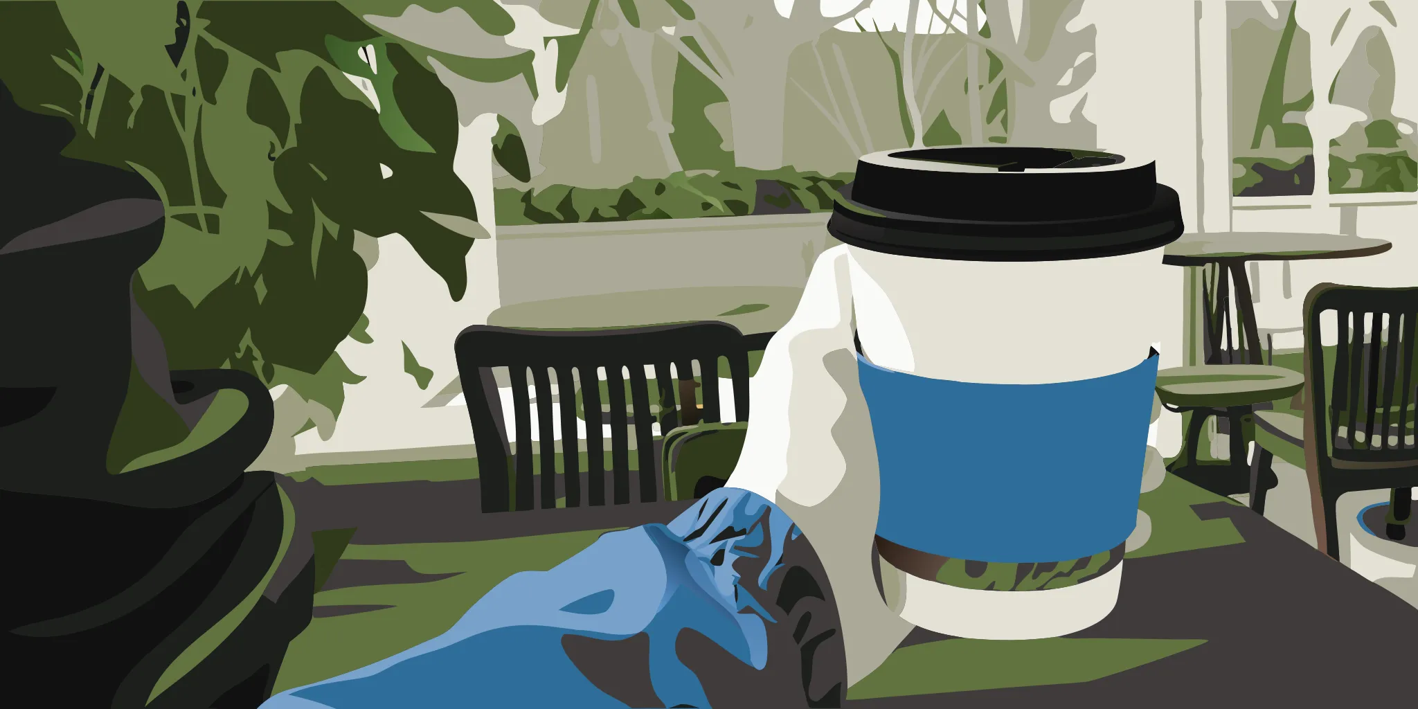Custom branded paper sleeve on a coffee cup inside a coffee shop