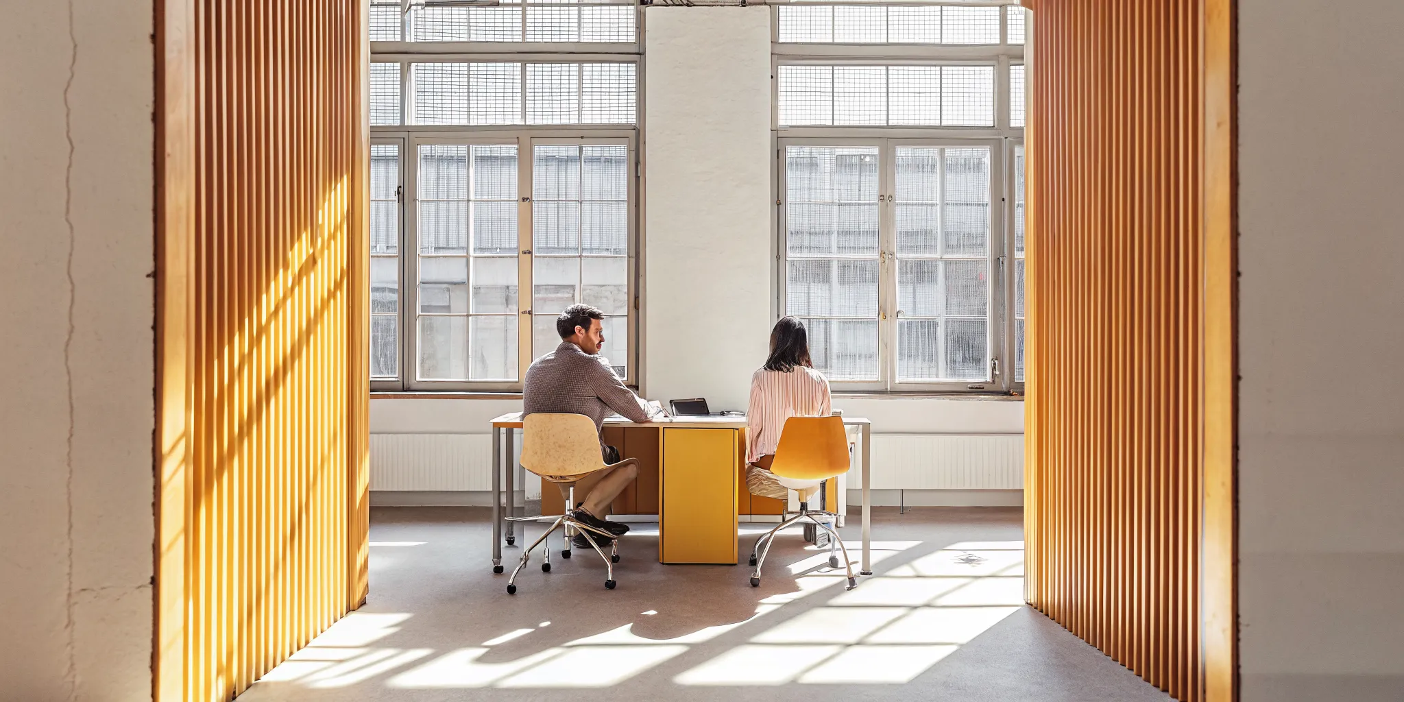 Business owner consulting with a Lyft Capital financing specialist in a bright office