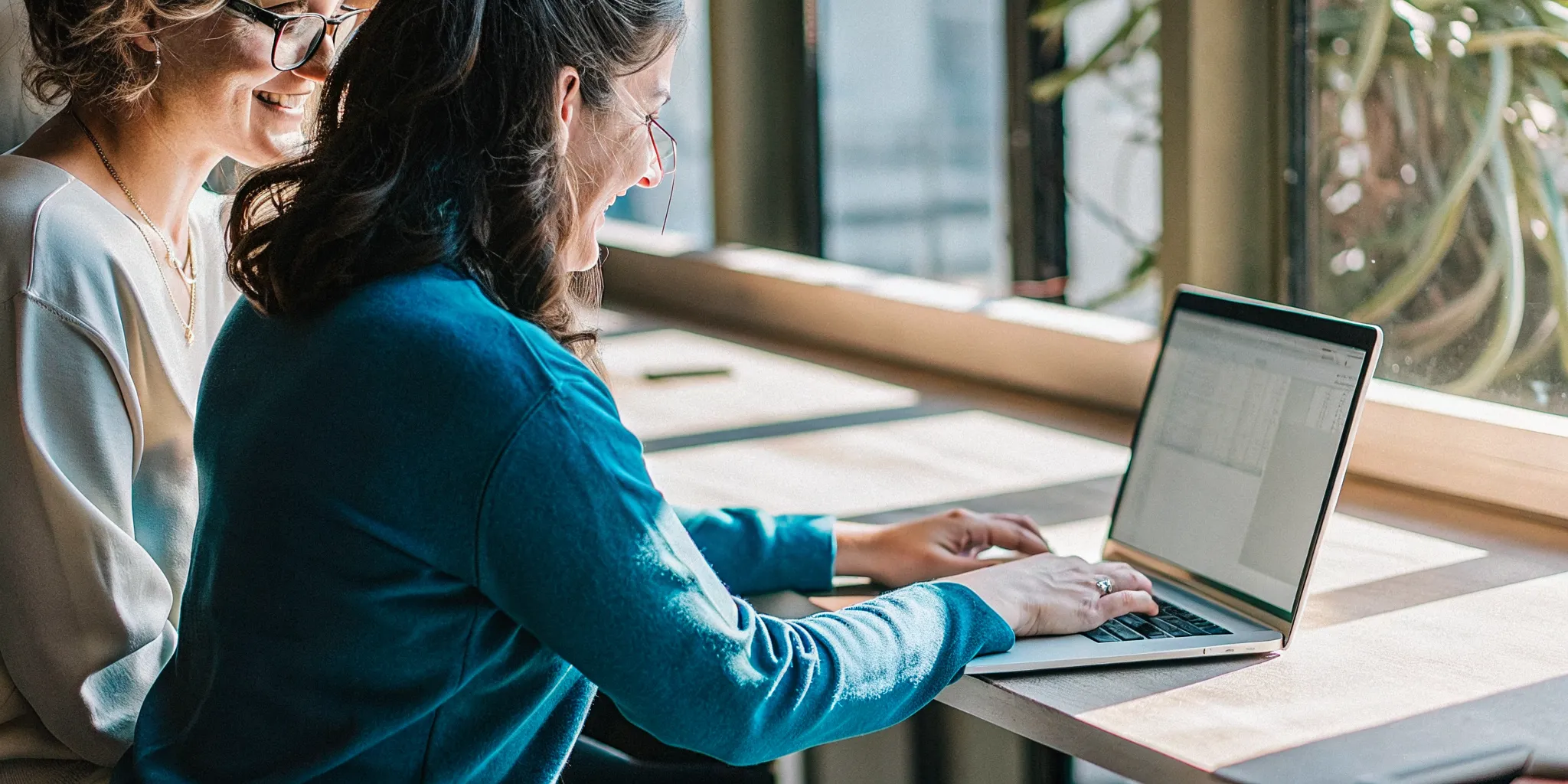 Small business owner submitting an online financing application with a financing specialist