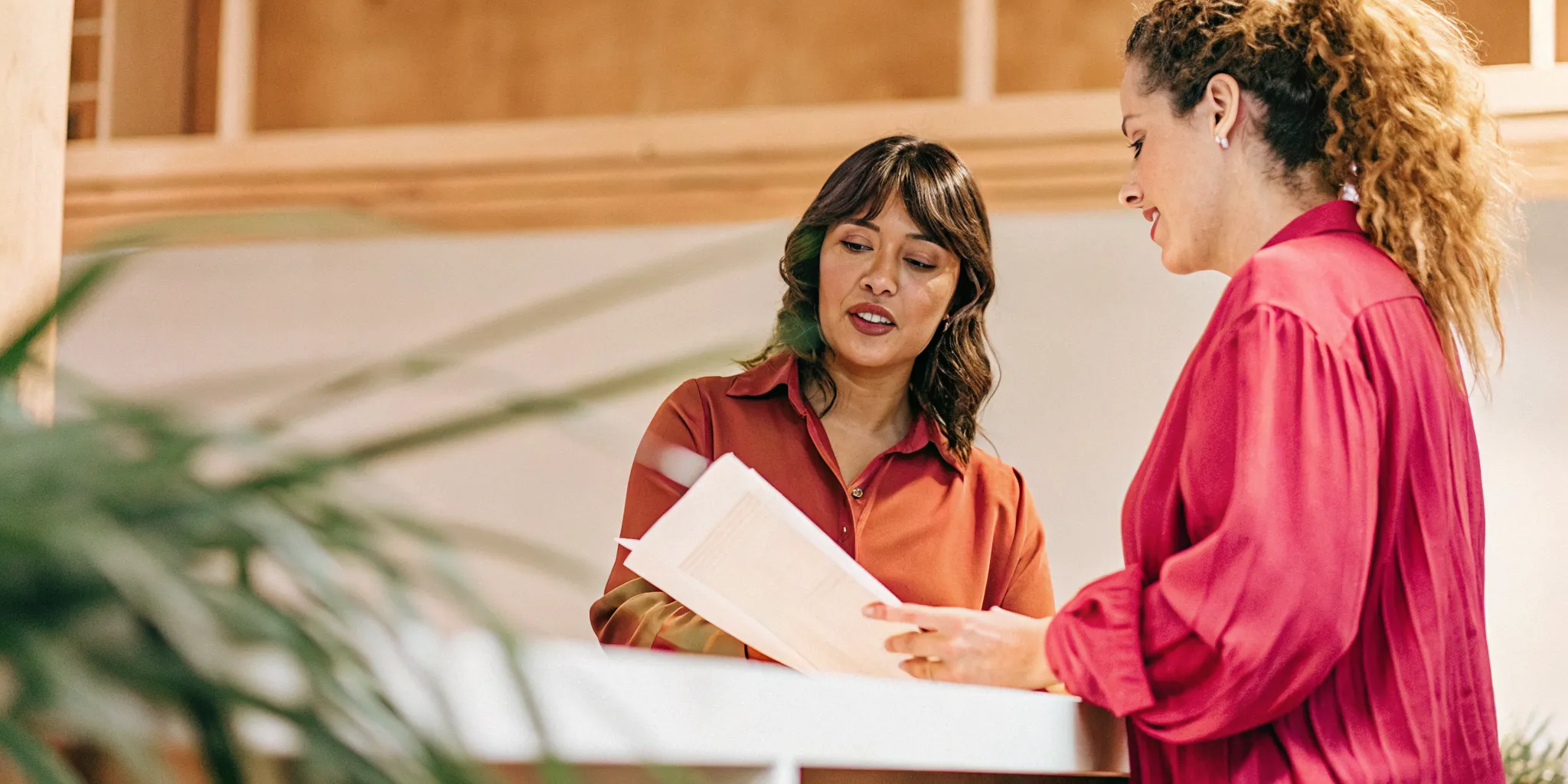 Financing specialist reviewing revenue and cash flow numbers with a small business owner