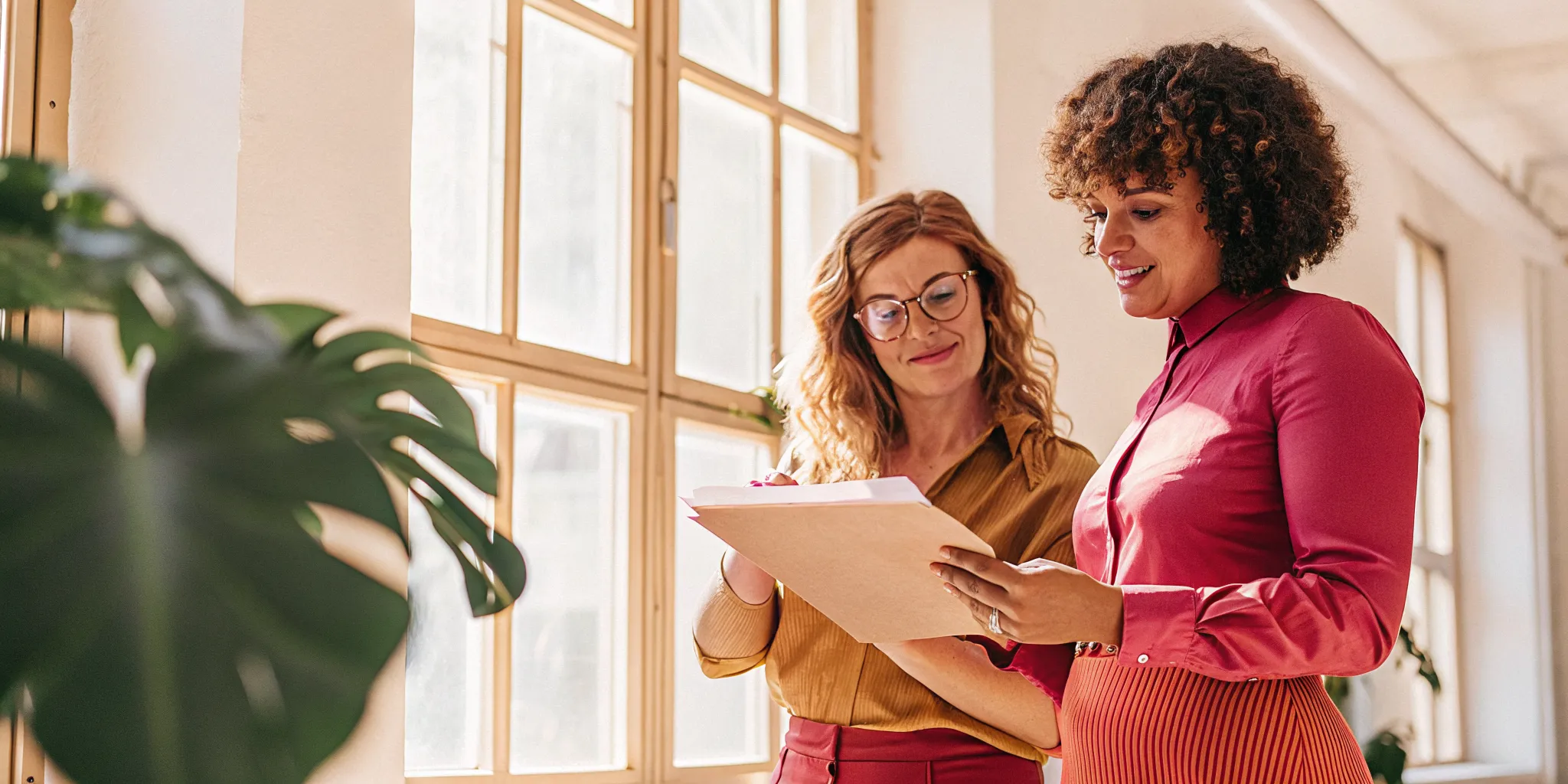Business owner reviewing a loan decision with a supportive financing advisor