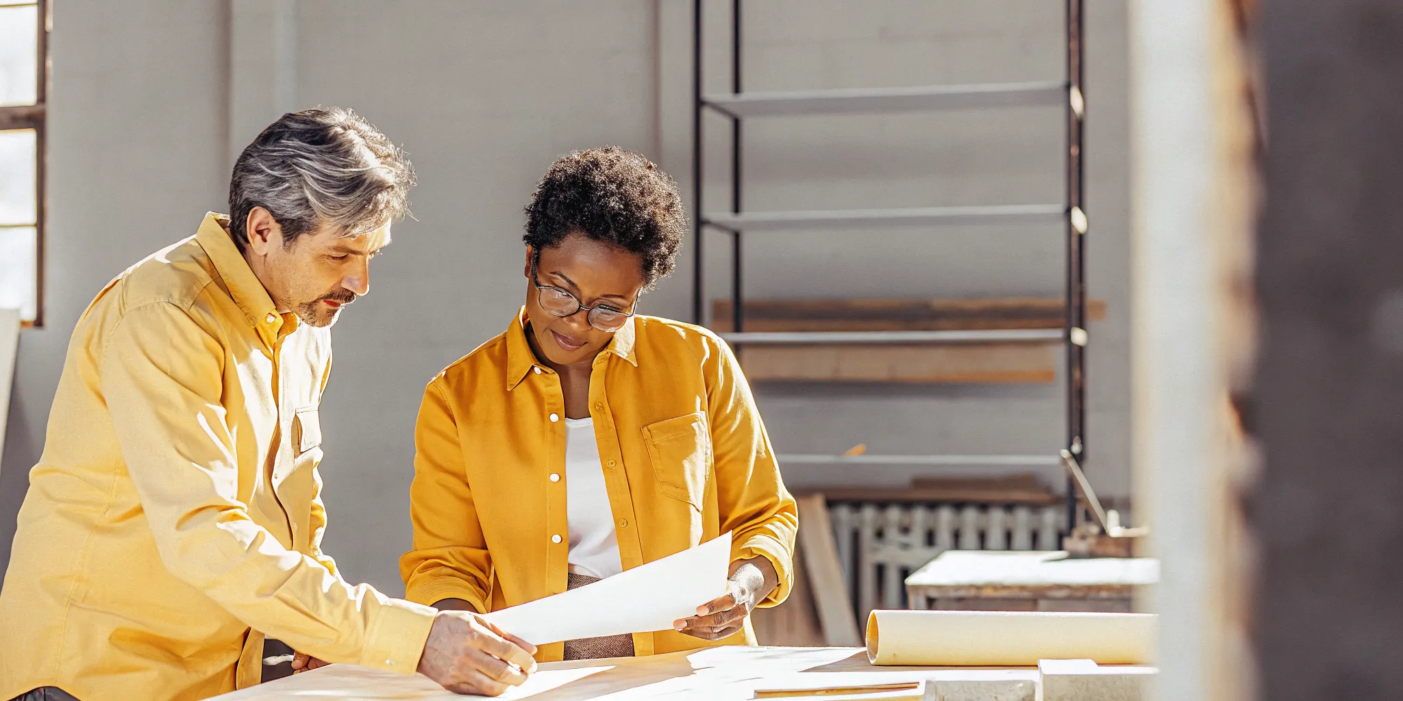 Business owner and financing specialist comparing a line of credit and term loan