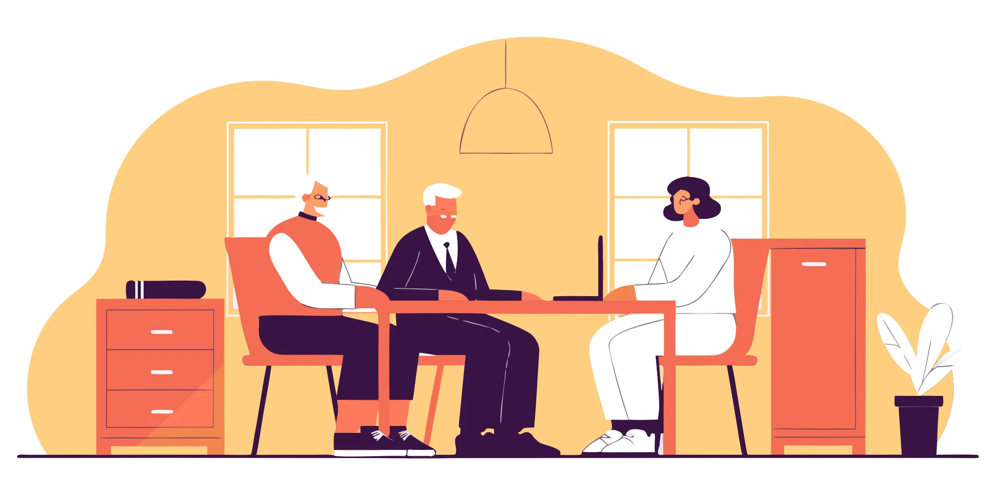An elderly couple discussing their long-term care planning with an elder law attorney