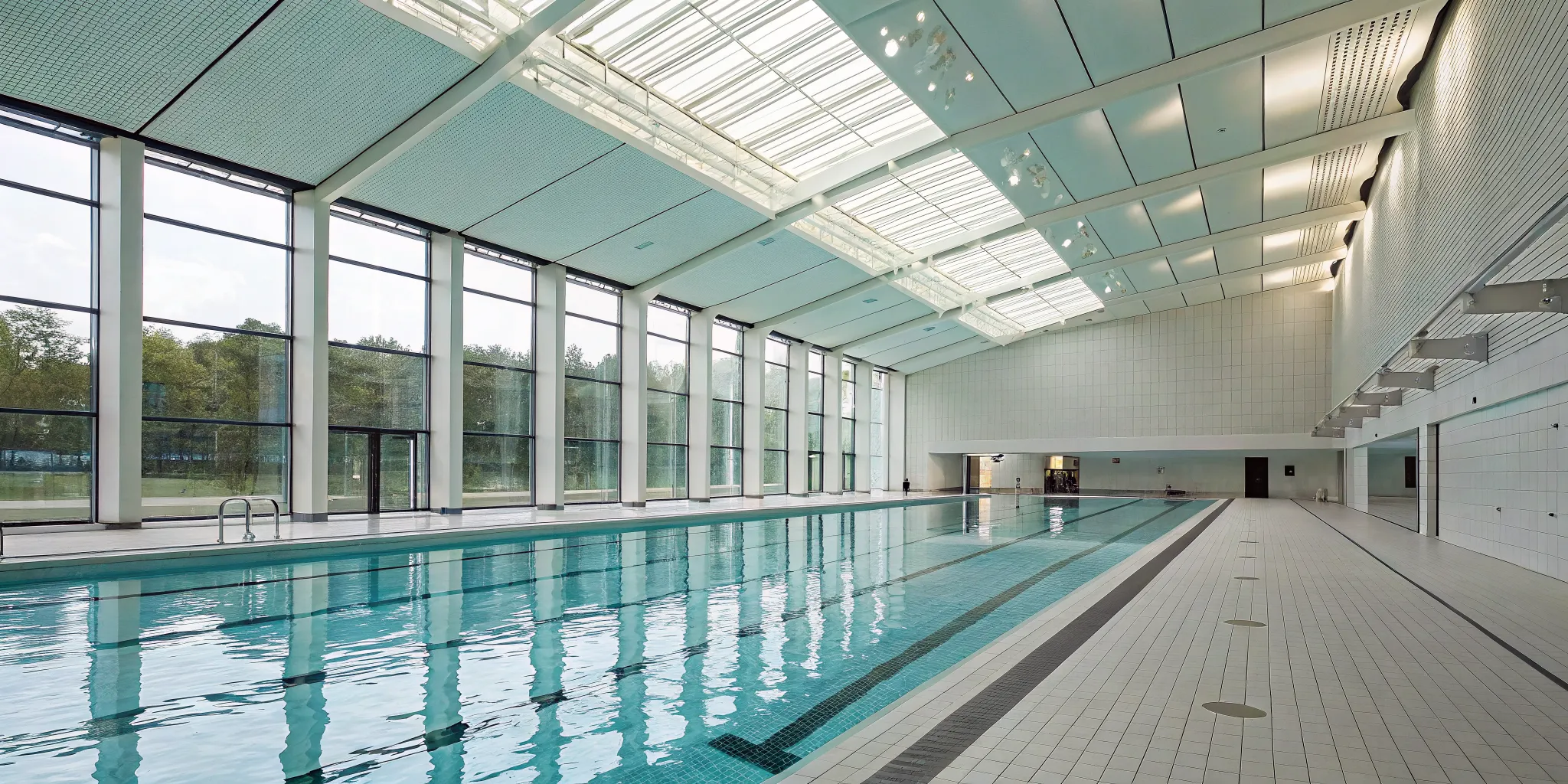 A modern swimming pool where drowning detection systems work to ensure swimmer safety.