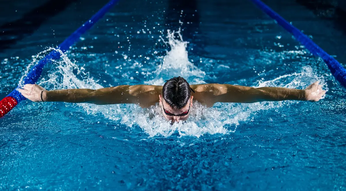 Athlete organizing simple recovery items after exercise