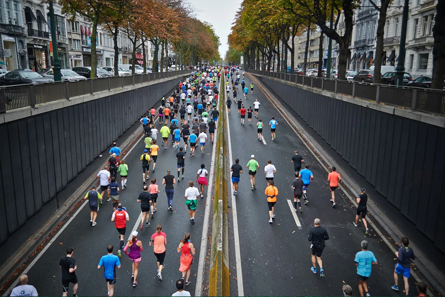 Runners filling a city roadway during a large road race