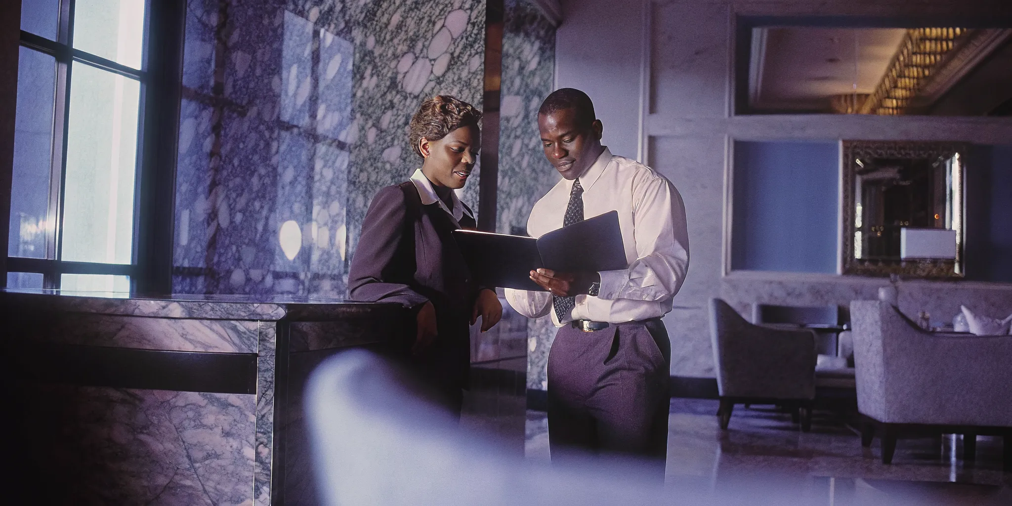 Hotel manager and security officer reviewing a security for hotels patrol plan