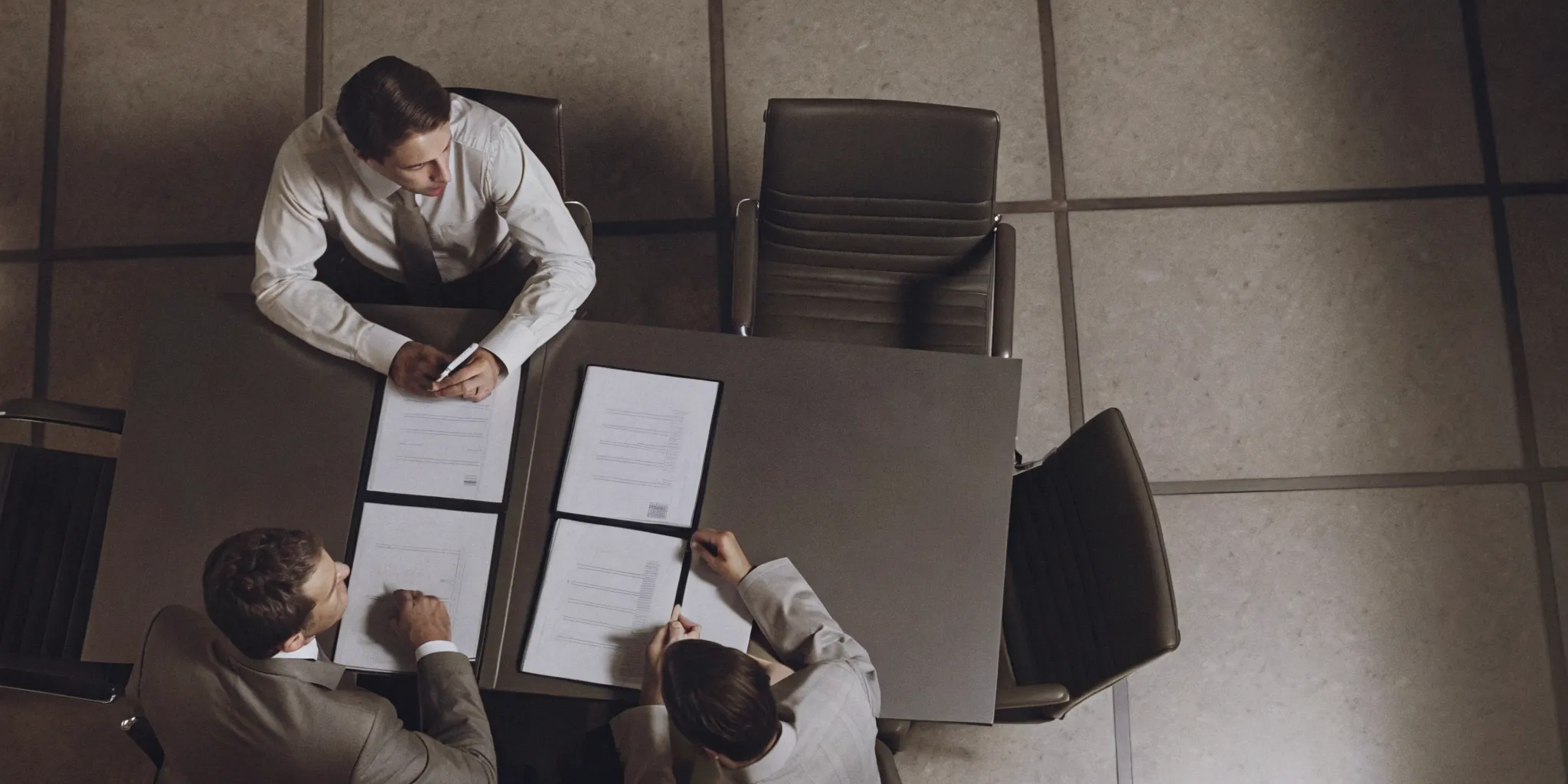 Corporate procurement team reviewing legal clauses in a security guard service agreement
