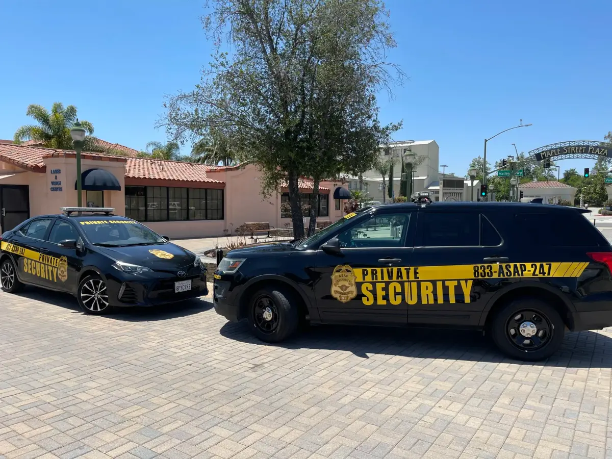 Security supervisor and guard reviewing a shift handoff at a commercial site
