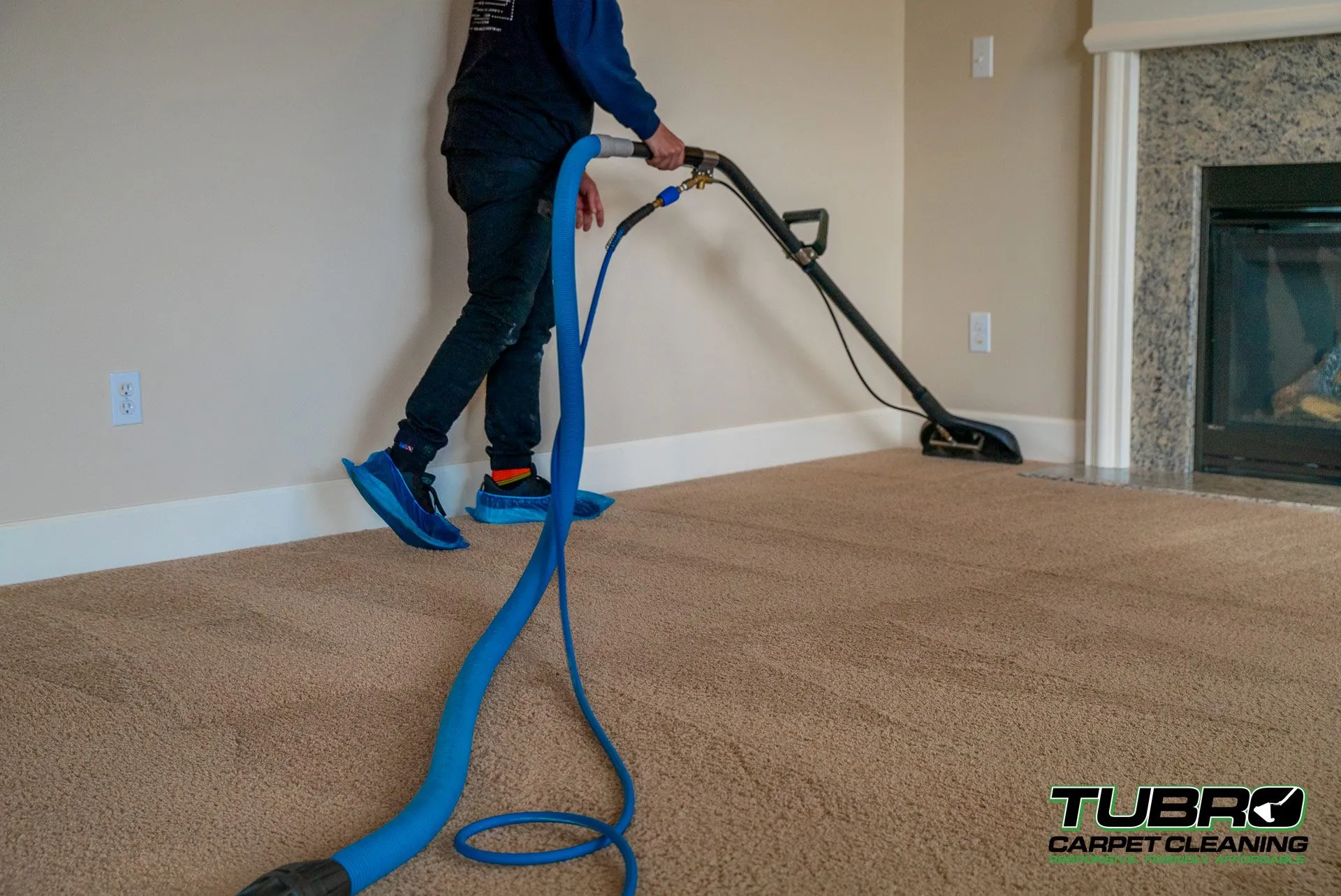 Technician performing deep carpet cleaning in a Maple Valley home
