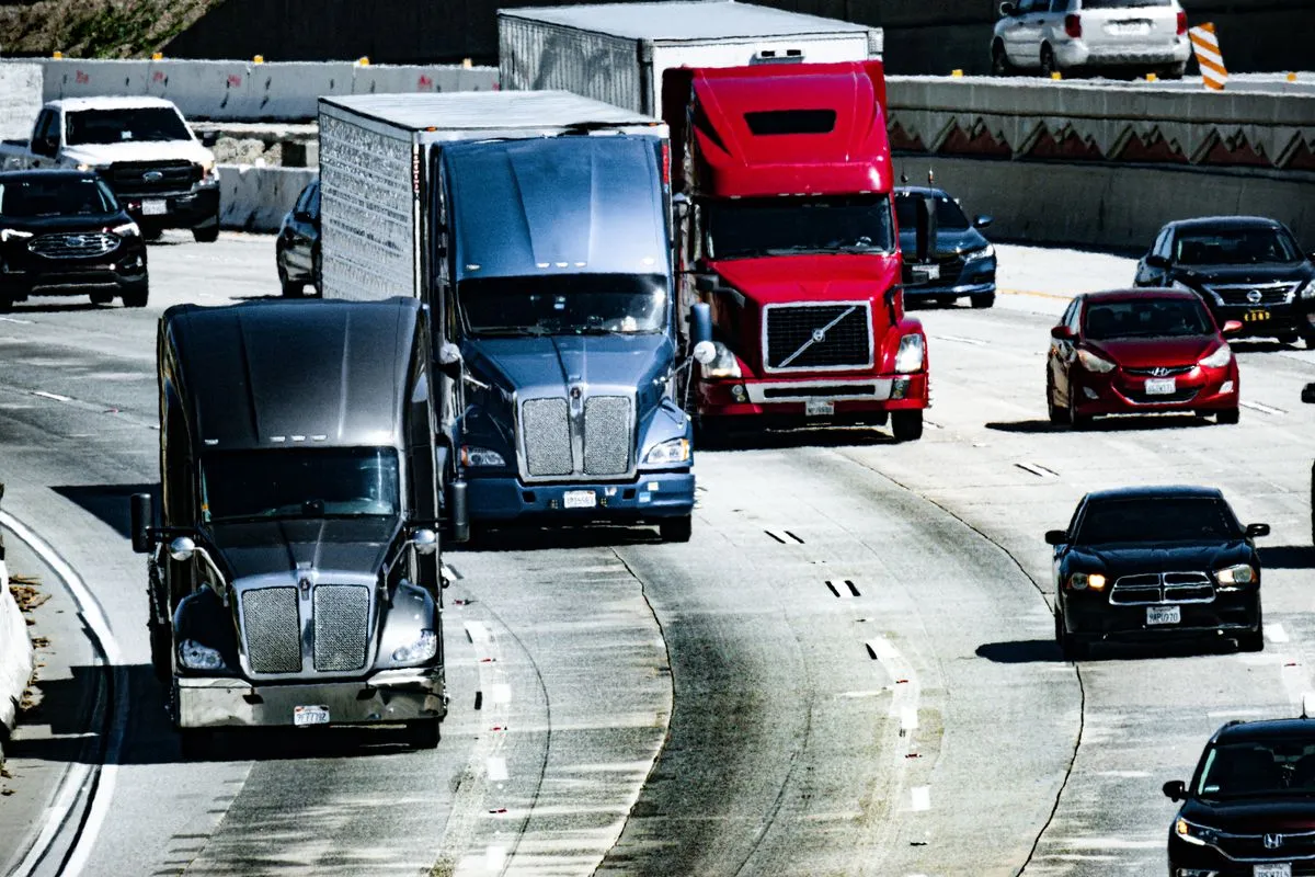 Trucks and passenger vehicles traveling on a congested Southern California highway