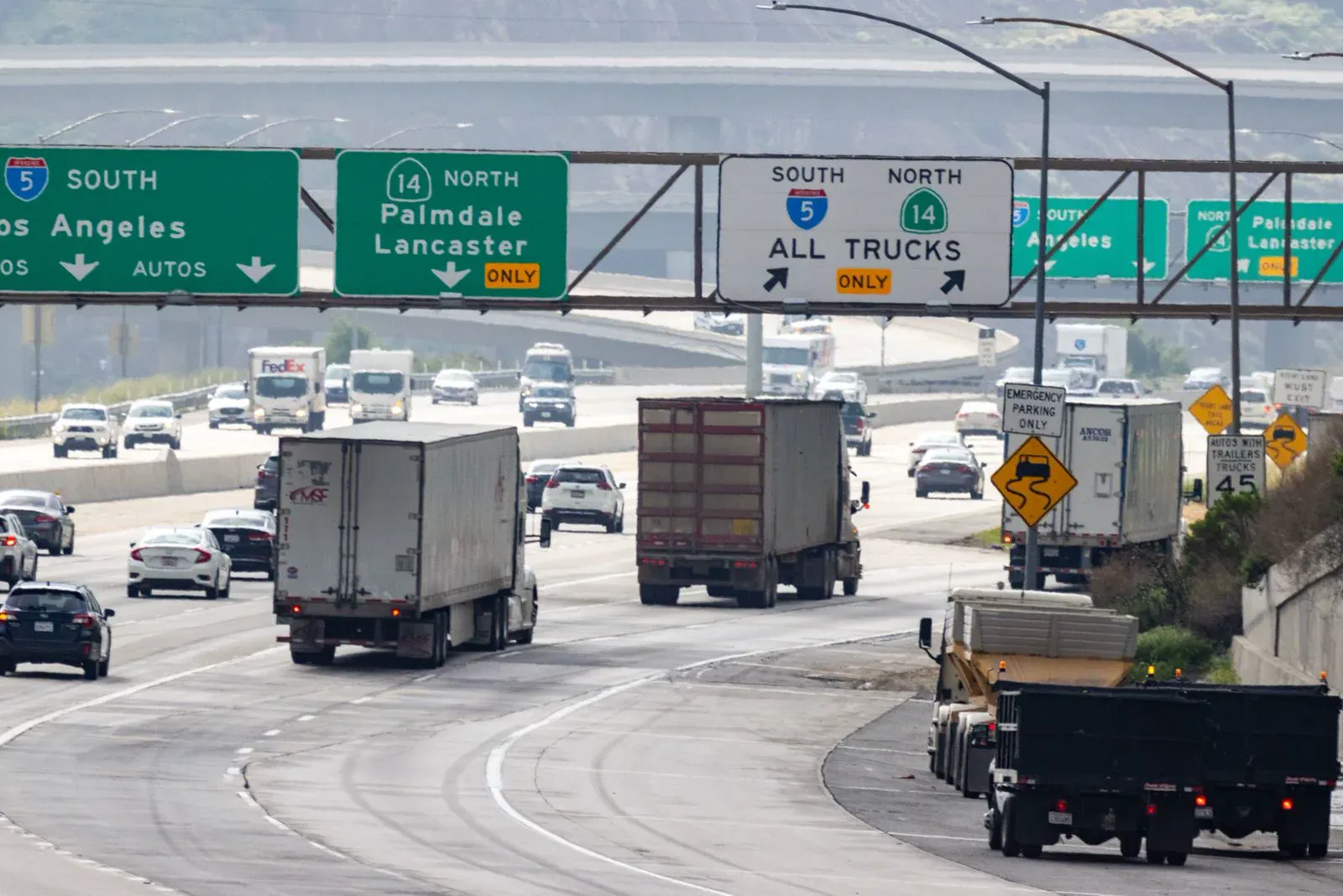 Traffic with cars and trucks on a California freeway near San Bernardino