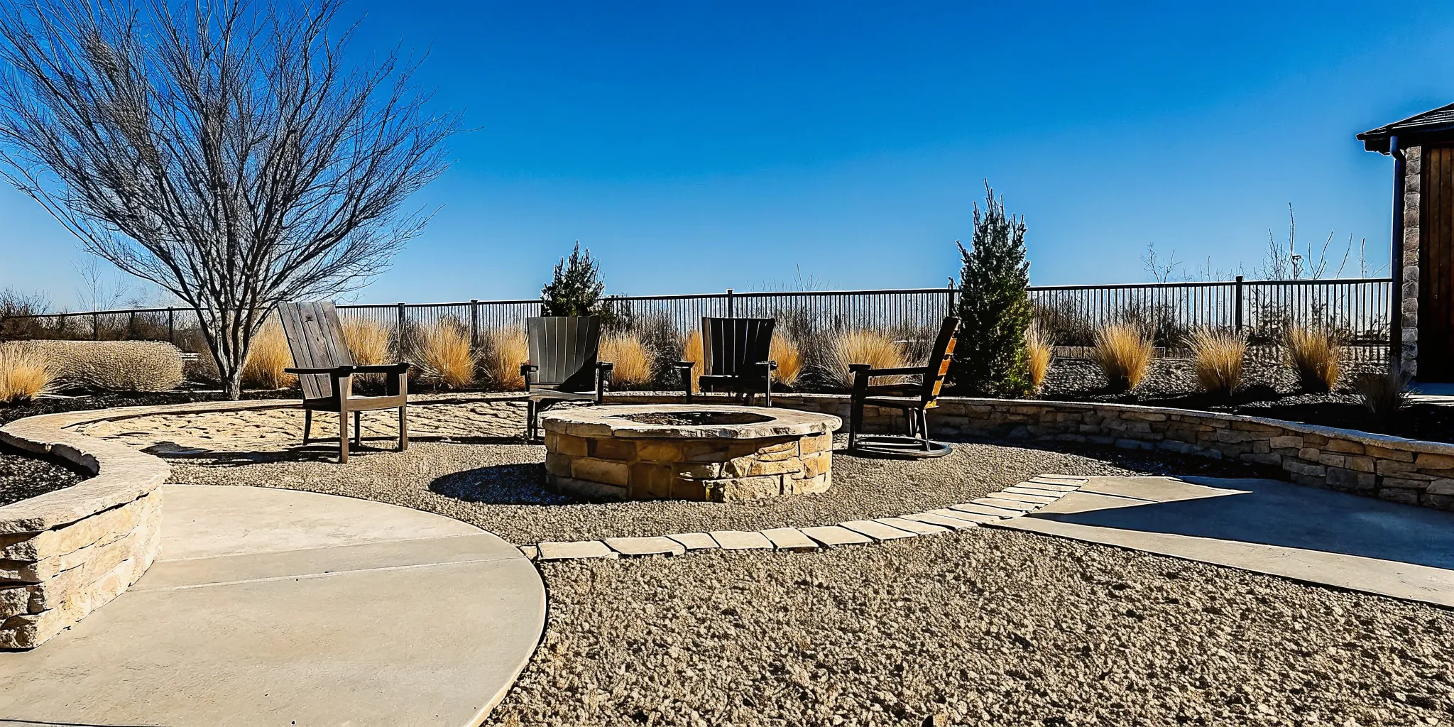 Finished decorative gravel seating surface around an unlit fire pit