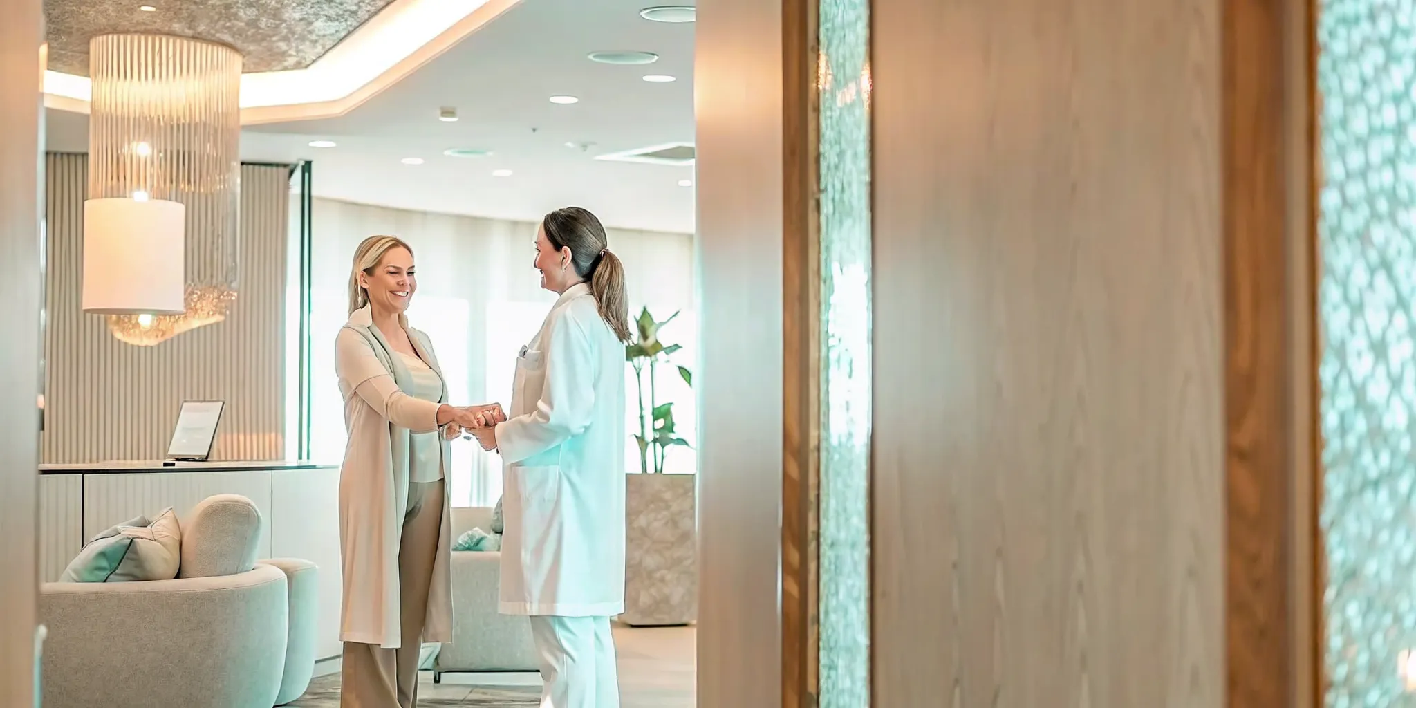 Luxury medical spa reception area welcoming a patient for an aesthetic consultation in Naples, Florida
