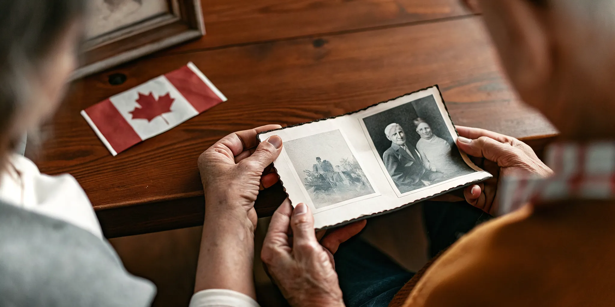 Family reviewing photographs while tracing Canadian citizenship by descent through a deceased parent