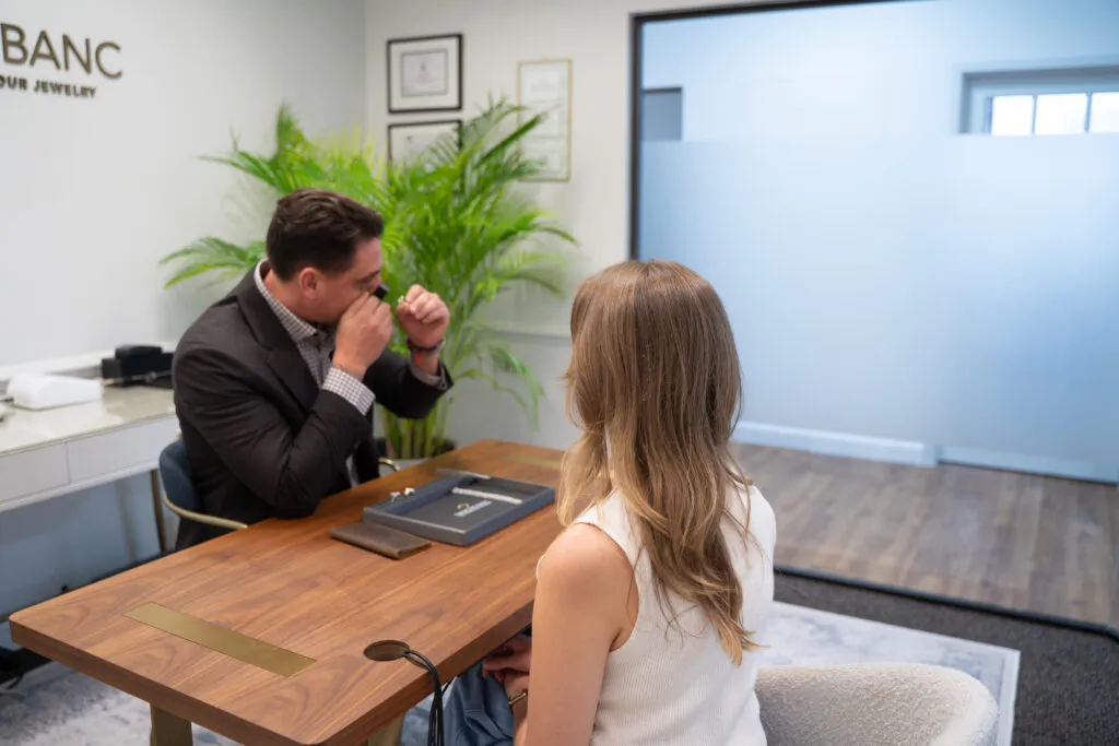 Diamond Banc evaluator and client reviewing jewelry during a Coral Gables consultation