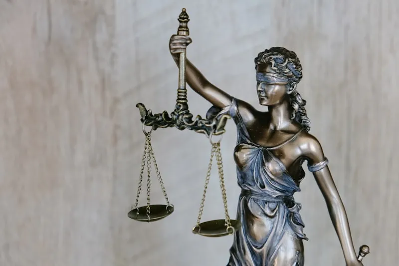 Legal scales and gavel representing lemon law consumer protections for used car buyers