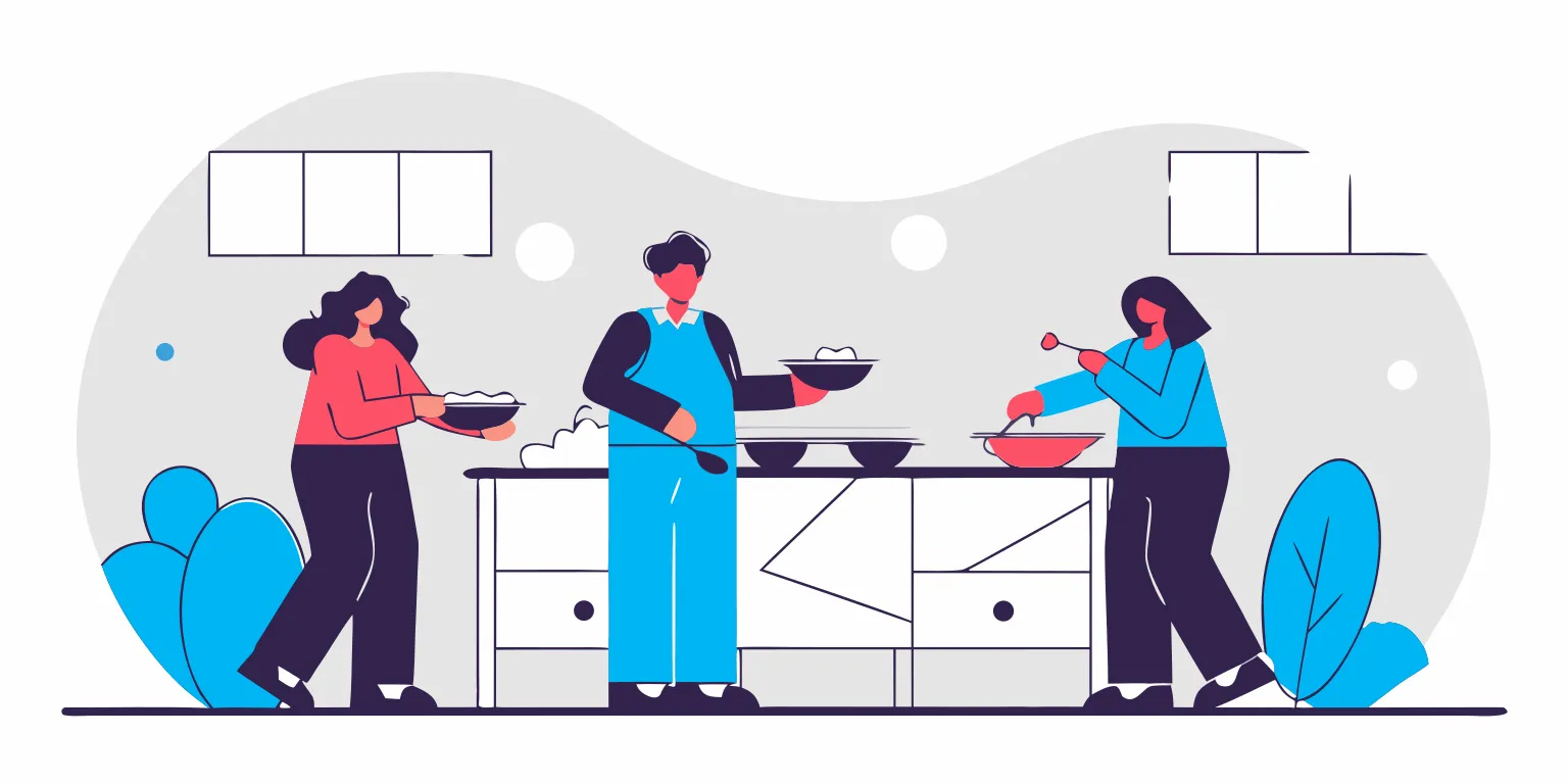 Coworkers serving themselves from family-style trays at a Portland office buffet lunch