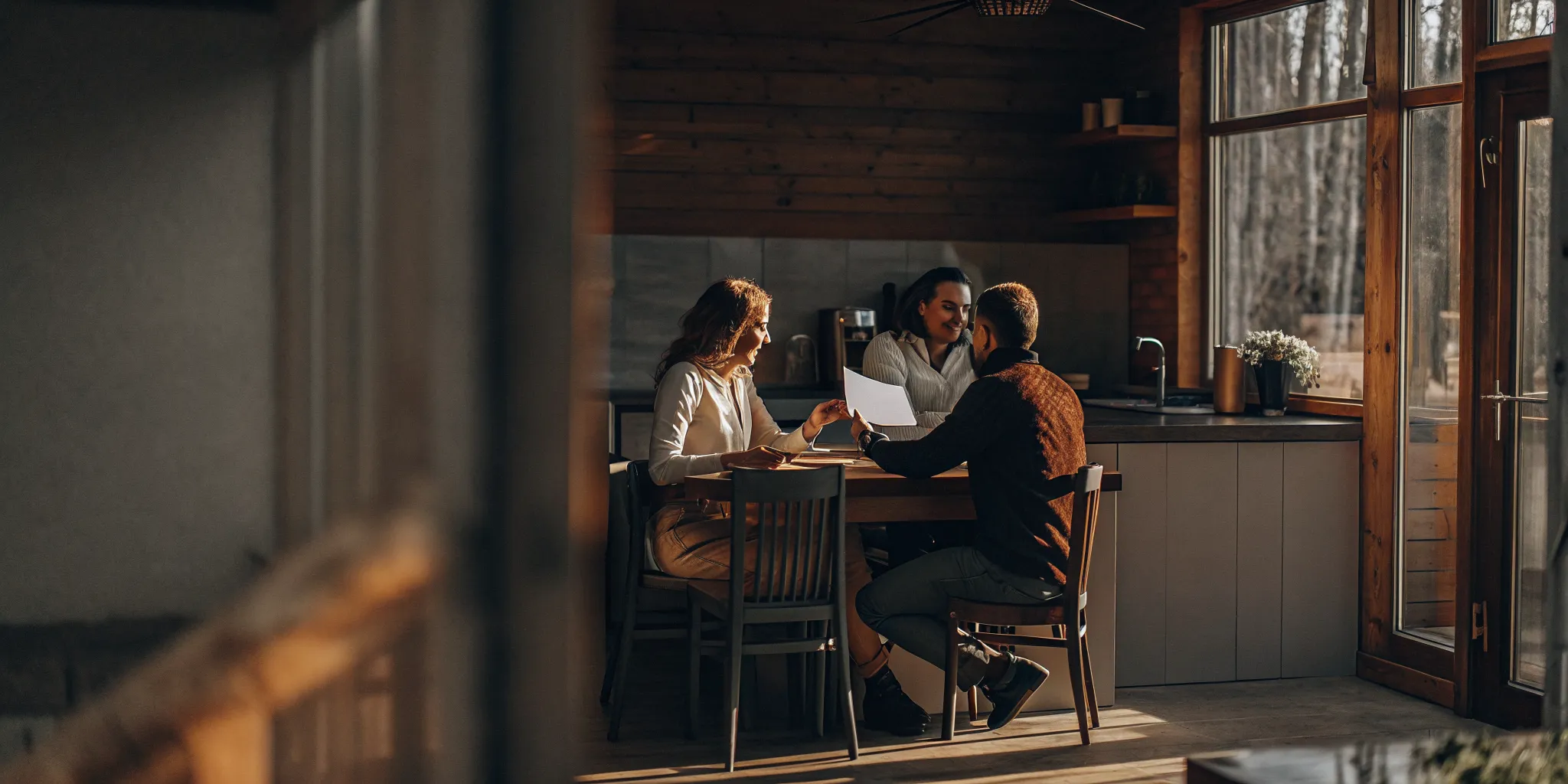 First-time homebuyer couple comparing FHA and conventional loan options with a loan officer