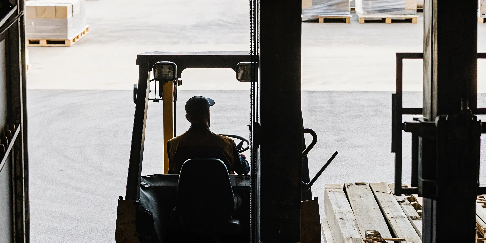 Forklift operator completing a pre-operation safety inspection
