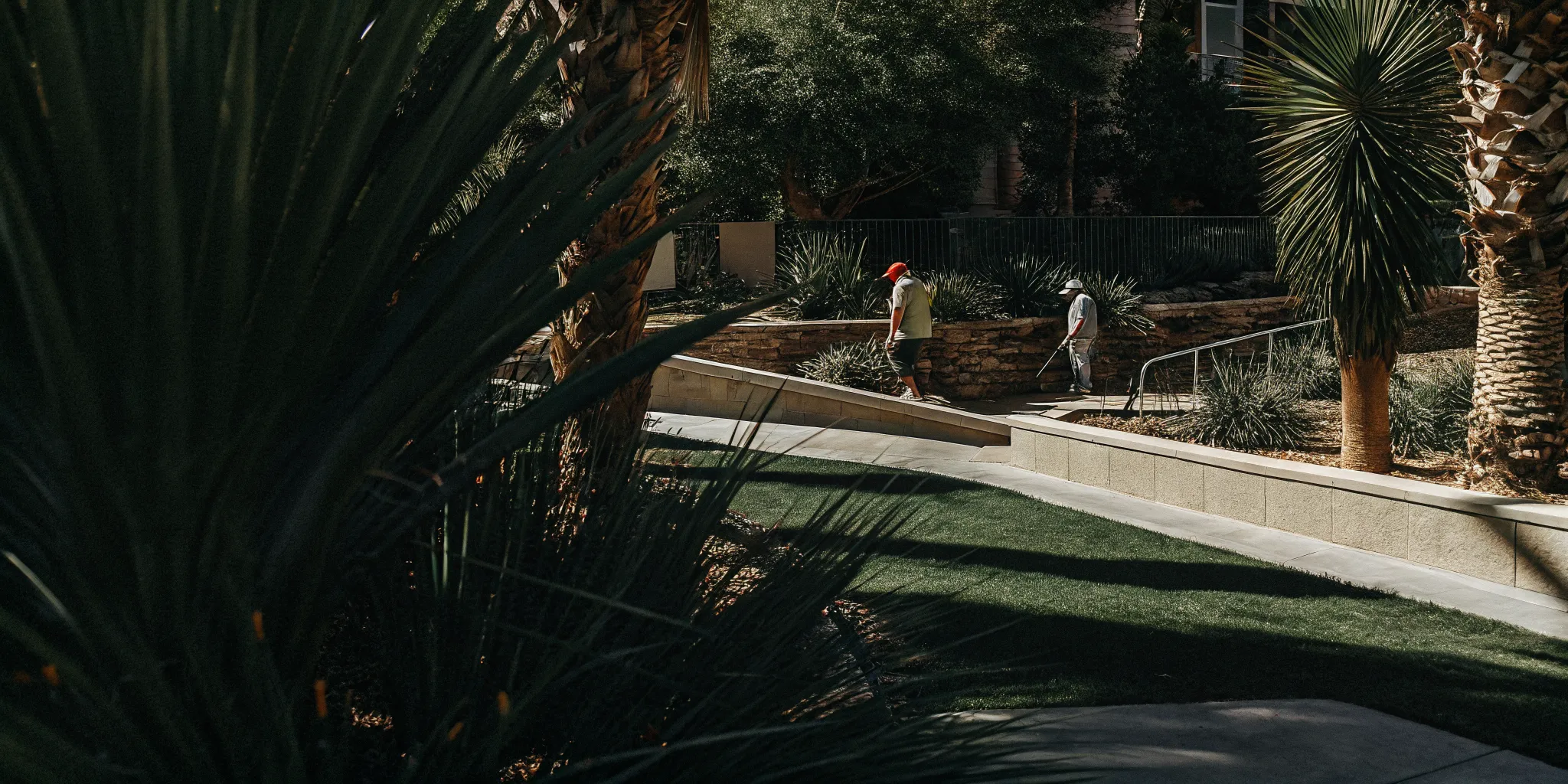 Professional pet waste removal crew cleaning common areas at a Las Vegas HOA community
