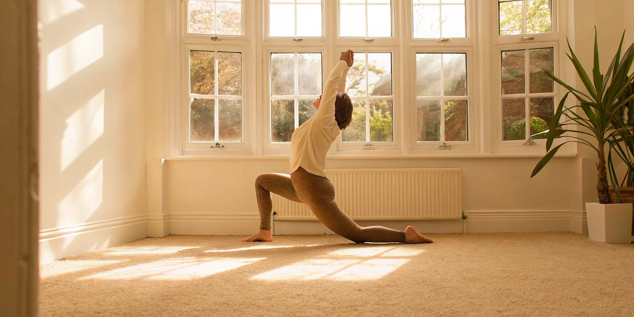 Woman practicing gentle yoga for a gut-friendly movement routine
