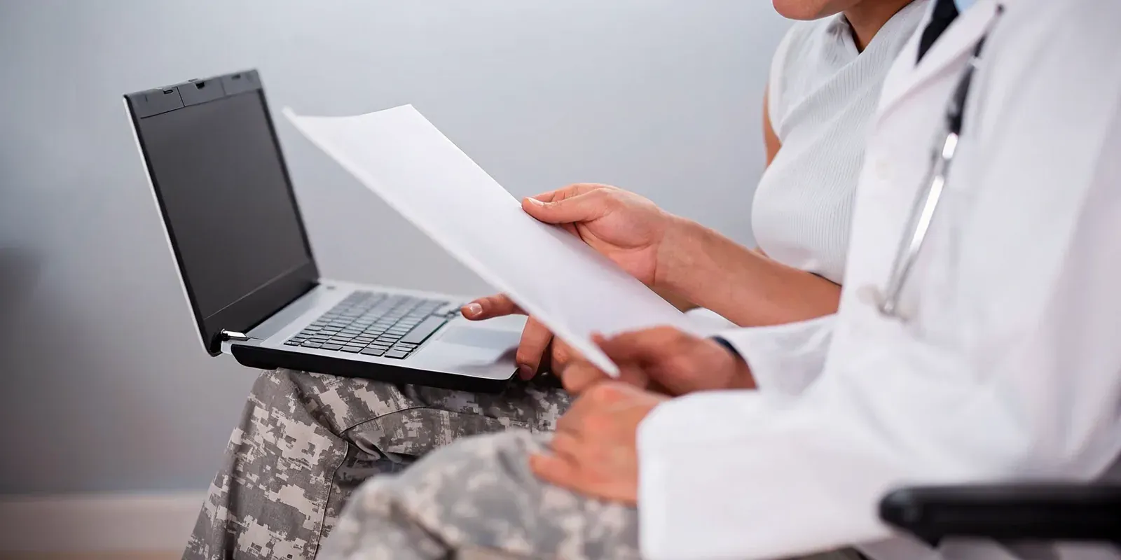 Doctor and veteran reviewing records for a nexus letter for VA claim