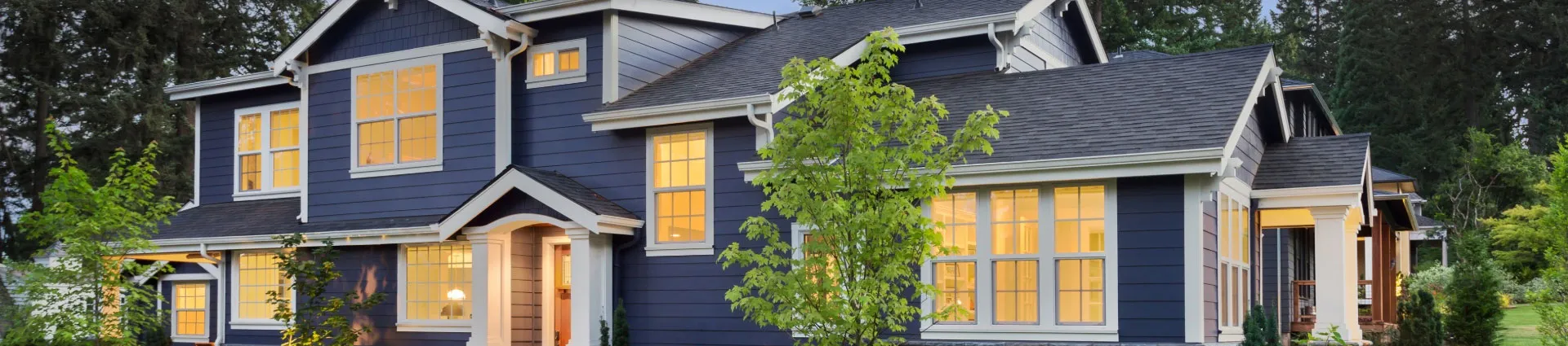 New Jersey home with freshly installed gray vinyl siding and white trim showing popular siding color combination