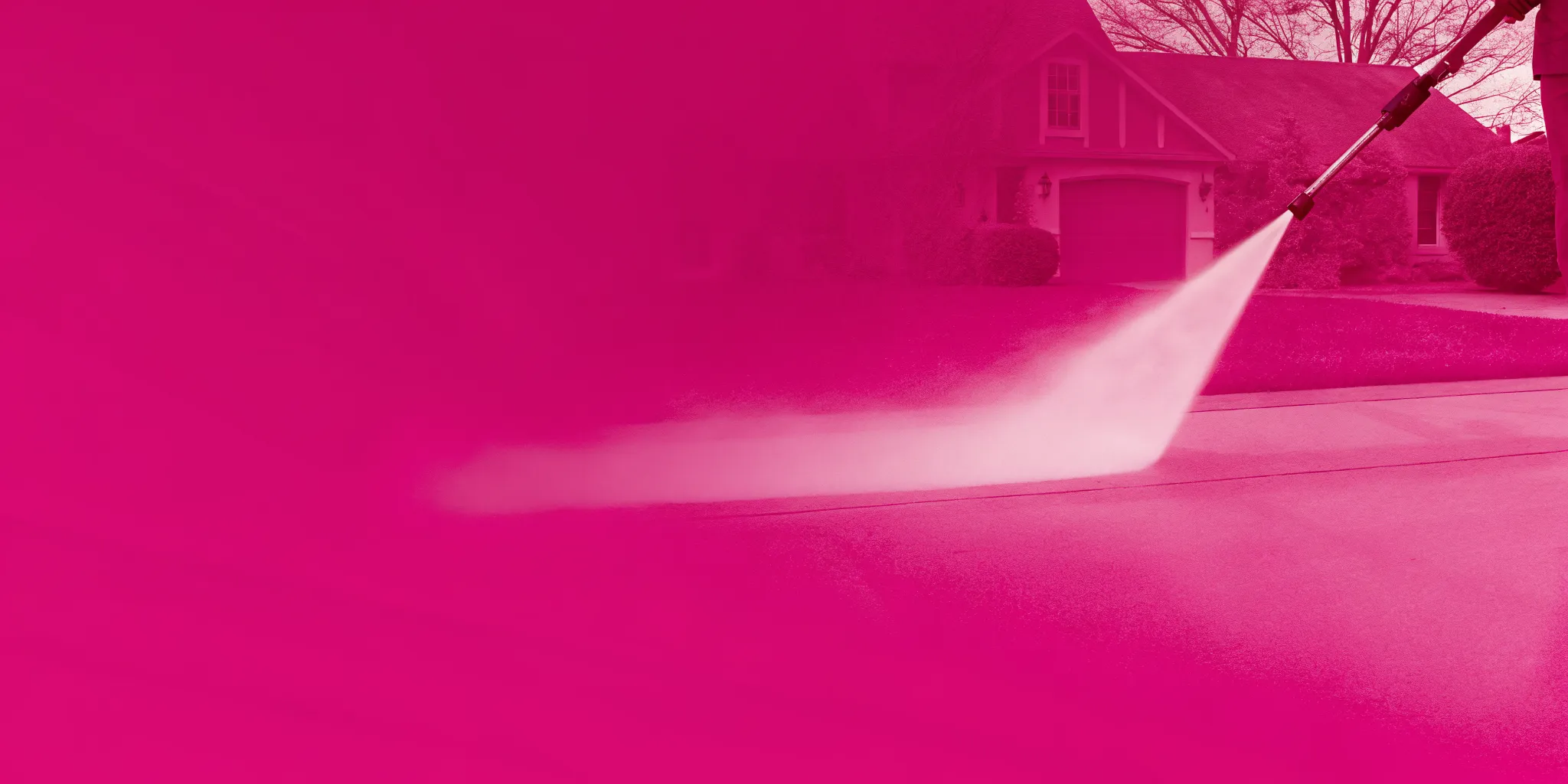Professional exterior cleaning technician pressure washing a concrete sidewalk or driveway in a Southlake neighborhood